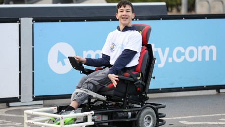 Fans try Powerchair Football at the Etihad