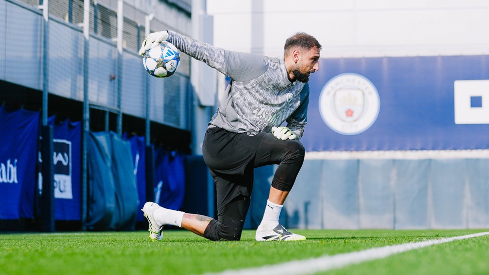 SAFE HANDS  : Gianluigi Donnarumma rolls the ball out. 