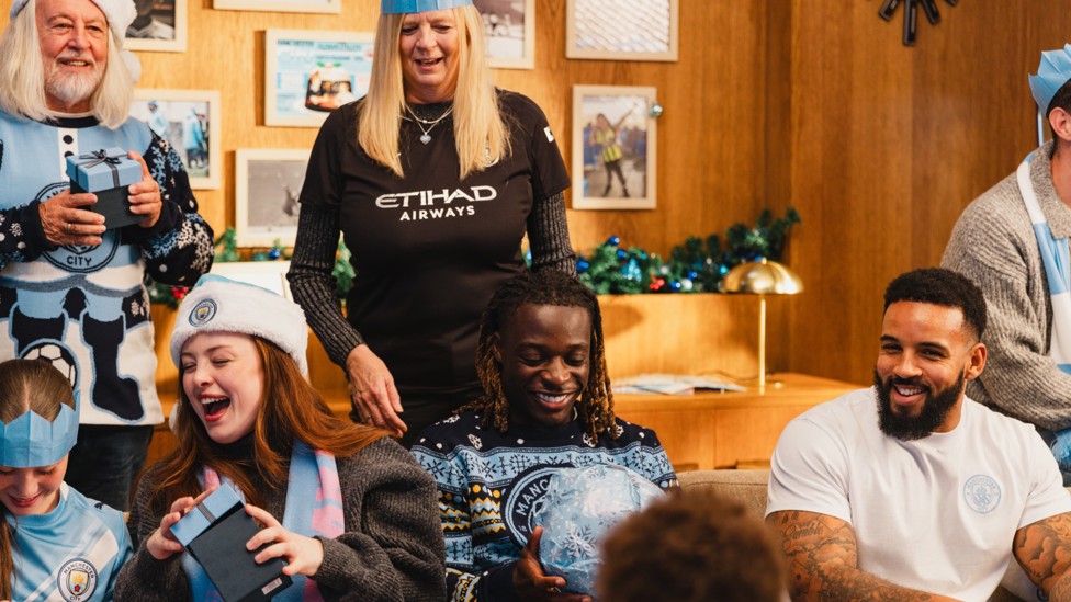FESTIVE CHEER : Doku was part of the Club's 2025 Christmas campaign and looked great in City's festive jumpers! 