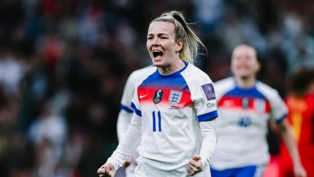 An English soccer player wearing a white jersey with number 11 celebrates during a match. The jersey features England's crest and UEFA logos.