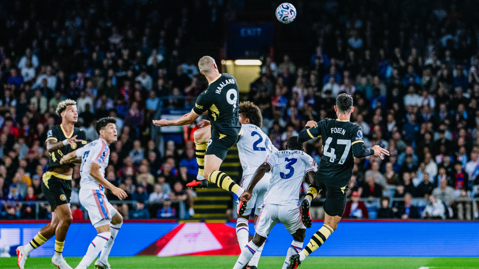 HAALAND HEADER : Rising high to head us in front.