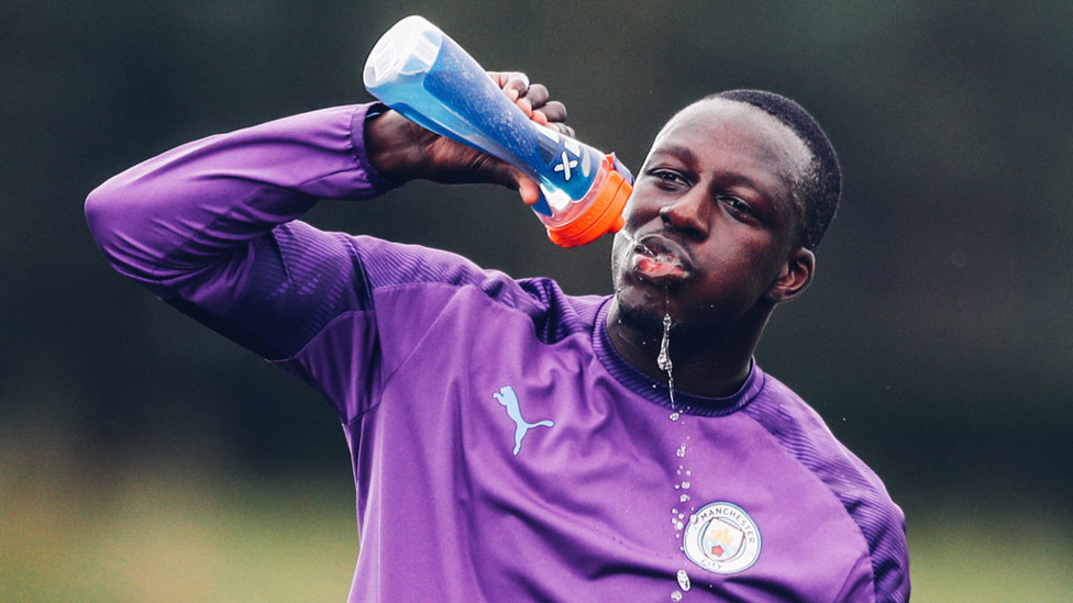 THIRSTY WORK : Benjamin Mendy rehydrates during a brief break