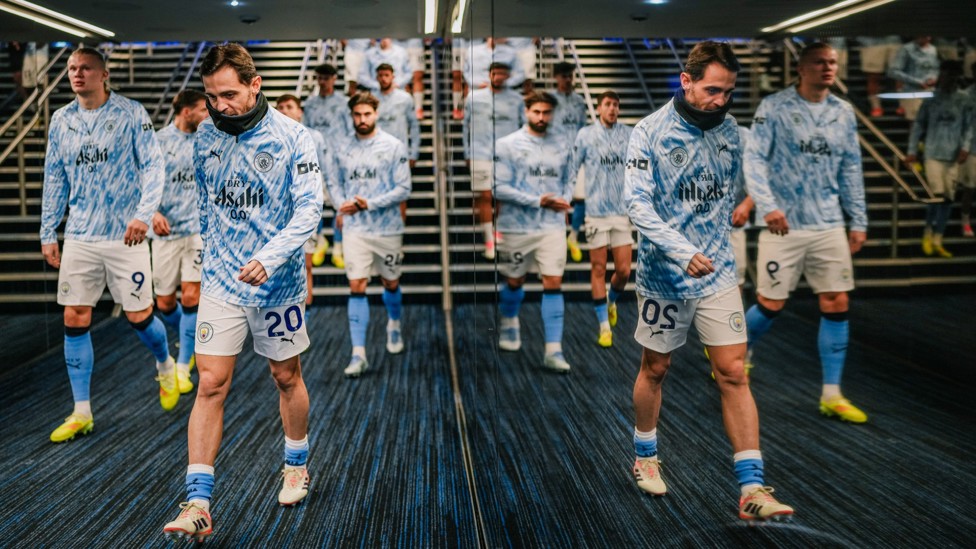 SEEING DOUBLE : The players make their way out of the tunnel for the pre-match warm up.
