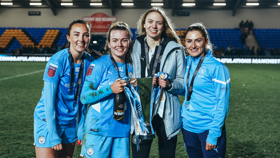 SQUAD GOALS : Coombs with the Conti Cup trophy with Esme Morgan, Lauren Hemp and Caroline Weir 