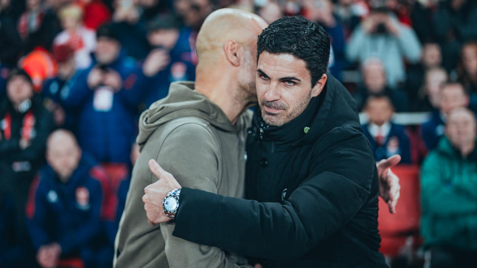 BOSSES : Guardiola and Arteta share a warm embrace ahead of kick-off.