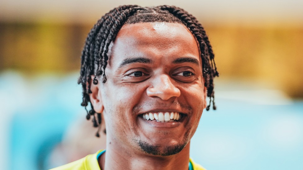 DEFENCE  : Manu Akanji shares a smile.
