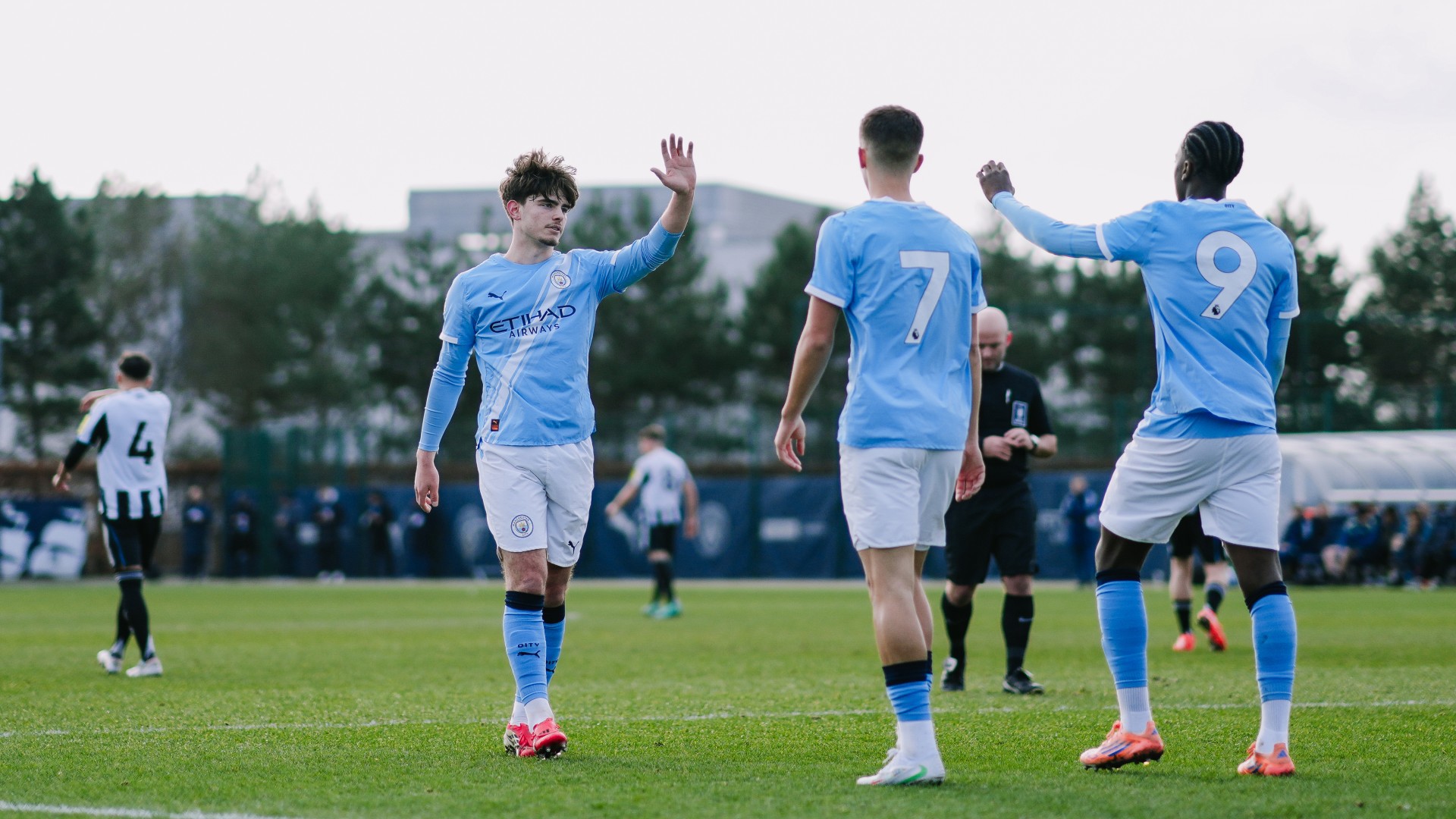 HIGH FIVES ALL ROUND : Dexter Oliver celebrates his opening goal with his team-mates.