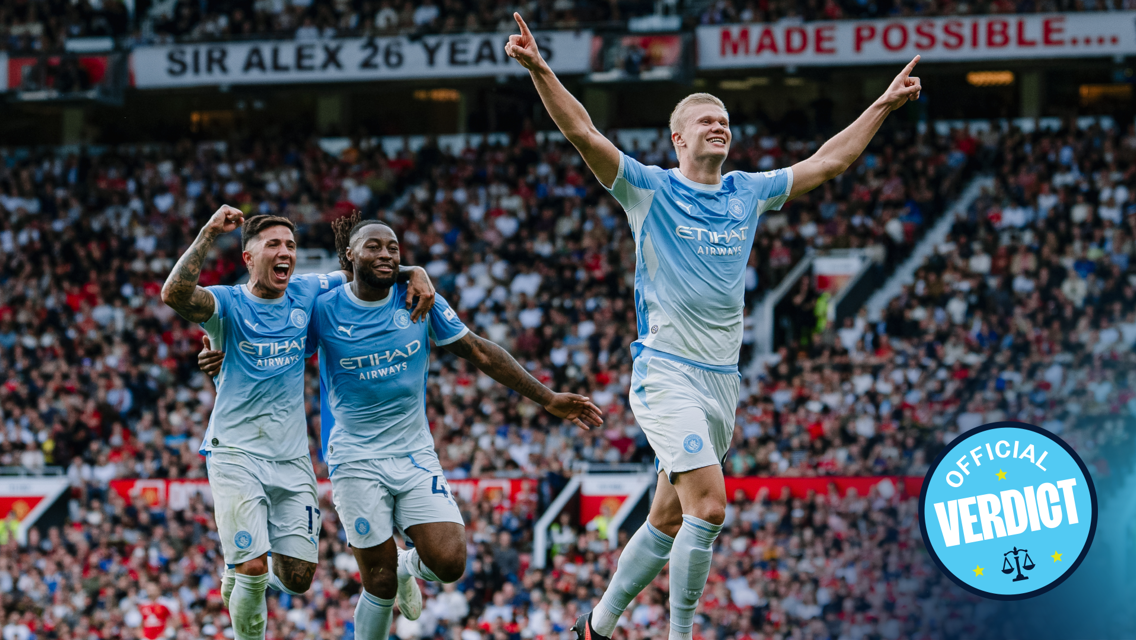 Three Manchester City players in blue uniforms celebrate a goal at Old Trafford. They raise their arms in triumph as the crowd looks on. A logo that reads 'Official Verdict' is visible.