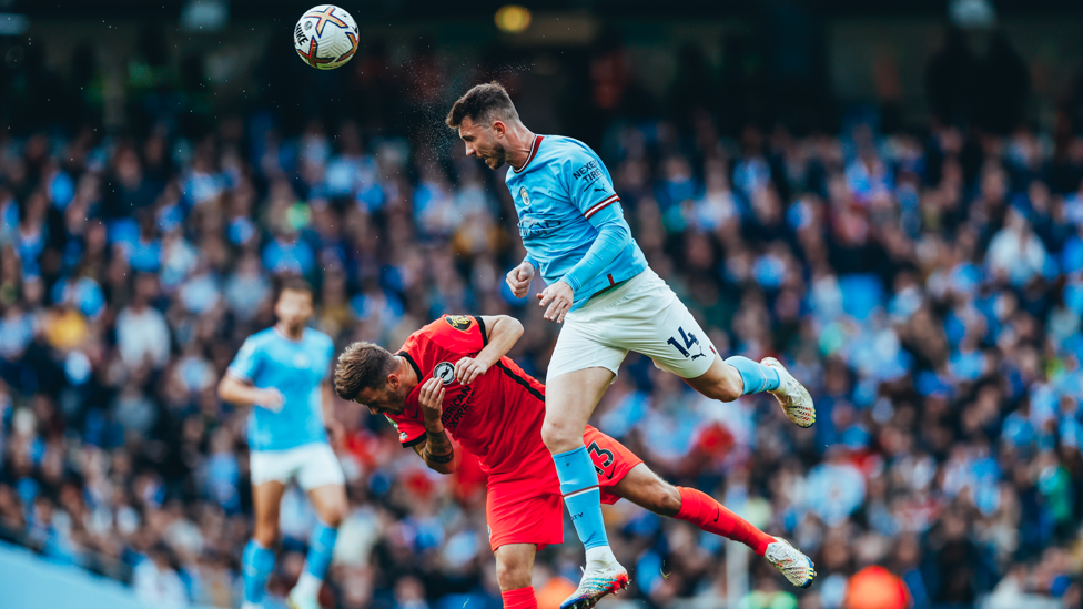 AYMING HIGH : Laporte rises highest to win the header.