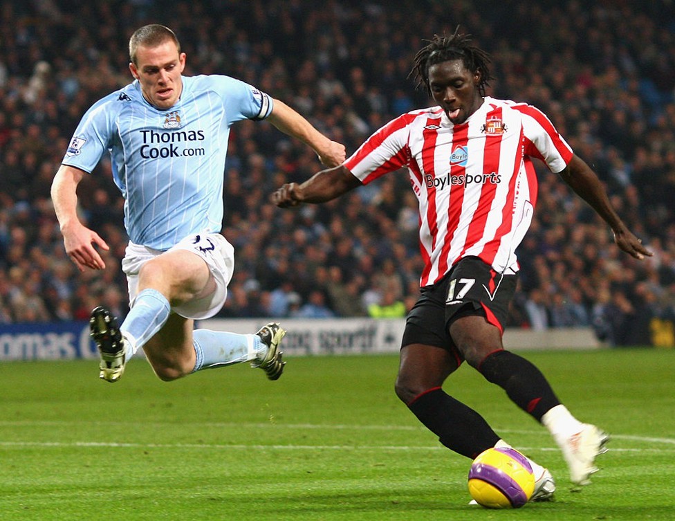 Agile : Dunne flies into a challenge with Stoke's Kenwyne Jones