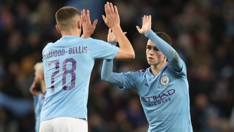 HIGH FIVE: Phil Foden and Taylor Harwood-Bellis celebrate against Port Vale.