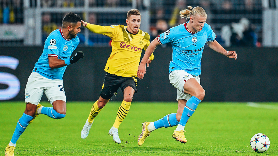 EAGER ERLING : Haaland bursts forward with the ball.