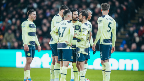 PLOTTING: Foden and co discuss a set-piece routine.