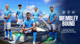 Manchester City players in blue jerseys standing in front of Wembley Stadium, advertising their match against Arsenal in the Carabao Cup Final on March 22, 2026.