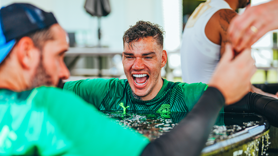 SAFE HANDS : Ederson and Scott Carson share a joke
