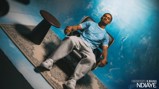 A person in a Manchester City football jersey is sitting on a chair against a blue background with text saying 'Welcome to City Iliman Ndiaye.'