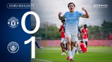 Manchester City player celebrating after a 1-0 victory against Manchester United. Emblems of both clubs are shown.