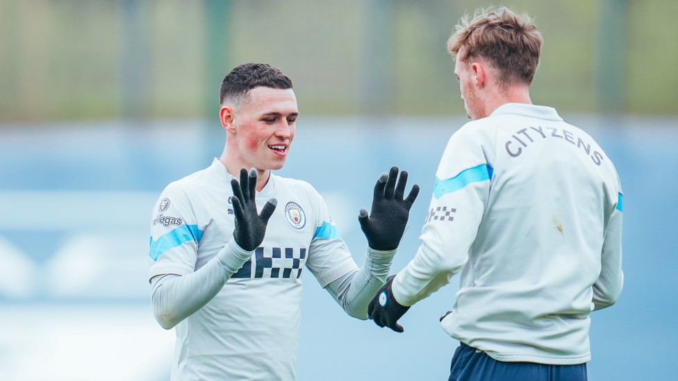 ACADEMY GRADUATES : Phil Foden and Cole Palmer brave the cold
