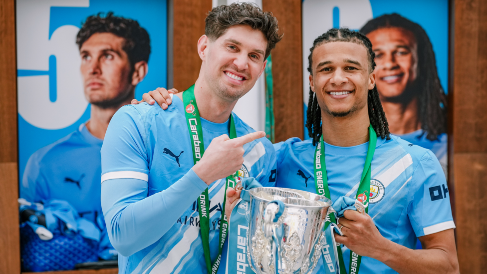 DEFENSIVE DUO : Stones and Ake celebrate.