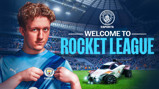 A Manchester City esports player holding the team's jersey, with a Rocket League car on the right and the text 'Welcome to Rocket League' in the background.
