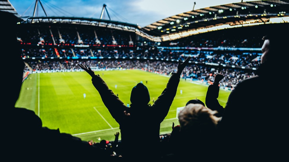 LOUD AND PROUD : City fans get behind the team at the Etihad