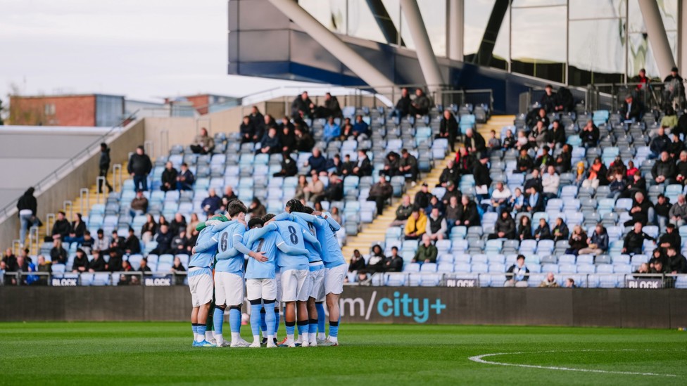 FINAL PEP TALK : The team have one final huddle before kick-off.