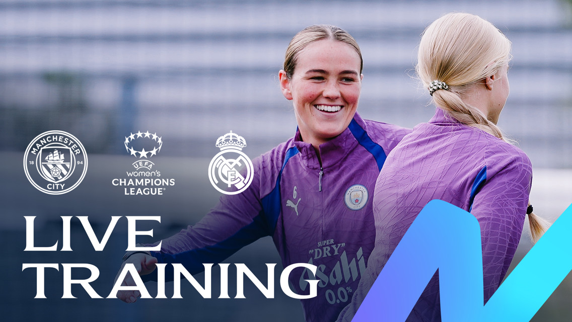 Two football players in Manchester City training kits are engaging during a live training session, with the logos of Manchester City, UEFA Women's Champions League, and Real Madrid displayed.
