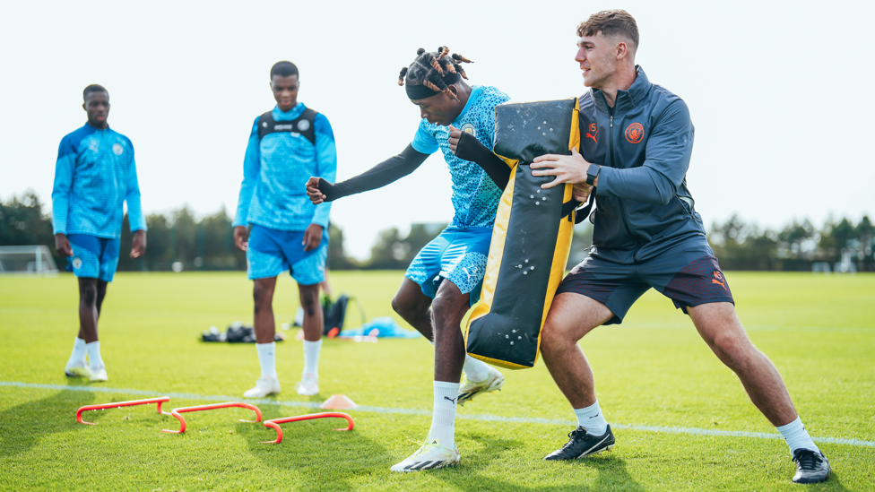 ACTION STATIONS: Joel Ndala is put through his paces by Nathan Sellers
