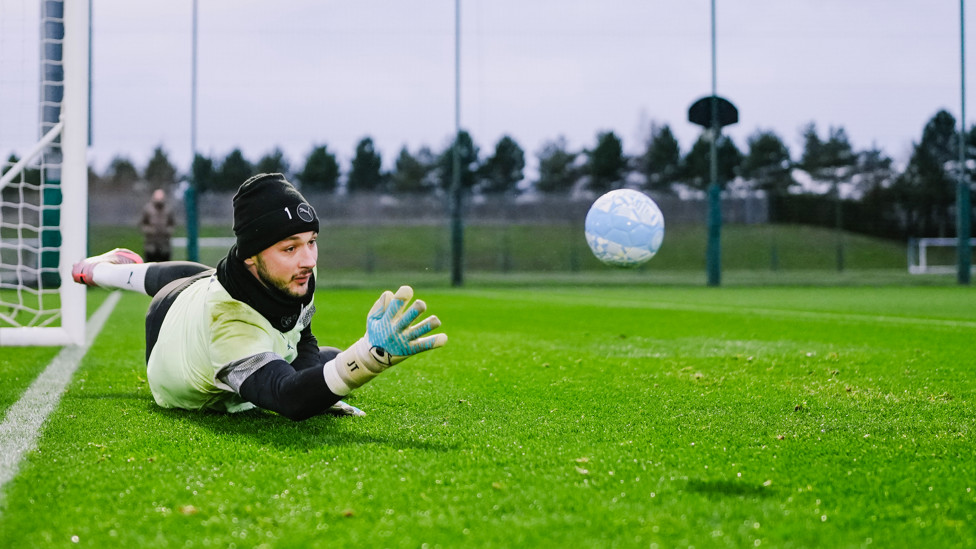 DOWN LOW  : Trafford makes the save. 