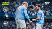 Two Manchester City players with blurred faces on the field during a match, featuring club logos and 'Full Match Replay' text.