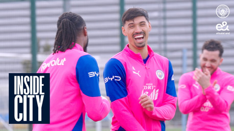 Manchester City players in pink and blue training gear during a session labeled 'INSIDE CITY'.