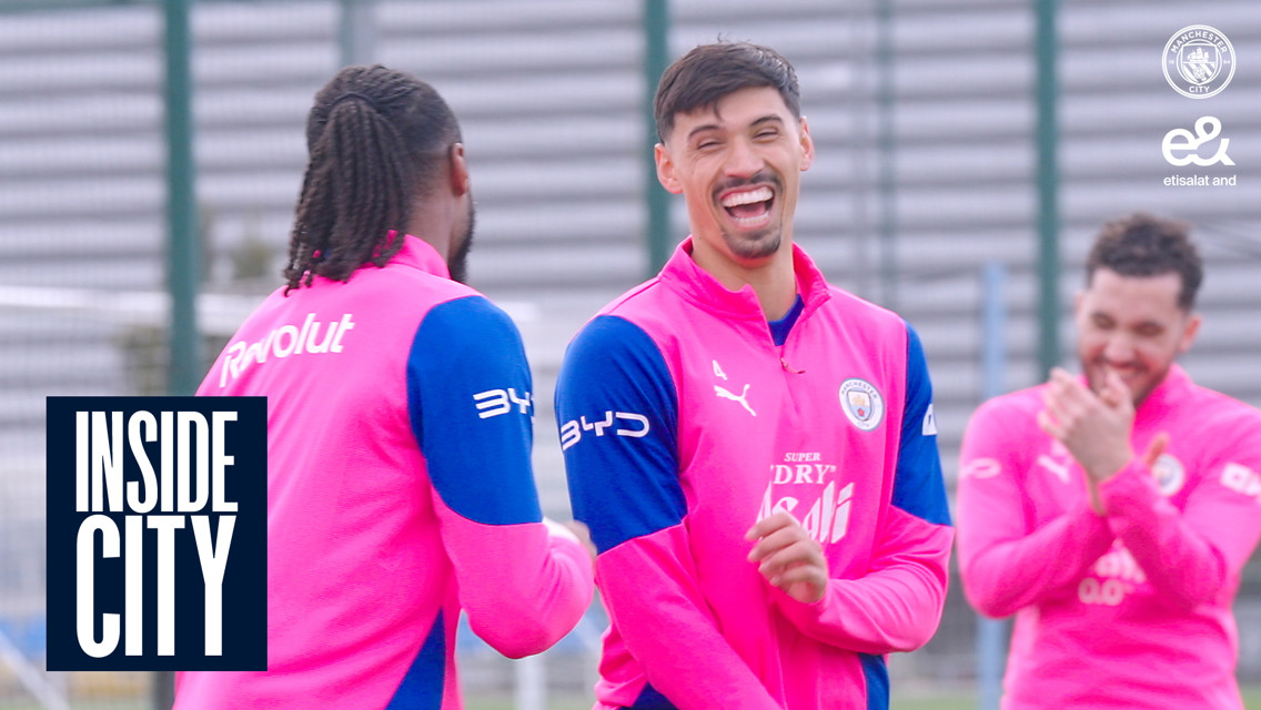 Manchester City players in pink and blue training gear during a session labeled 'INSIDE CITY'.