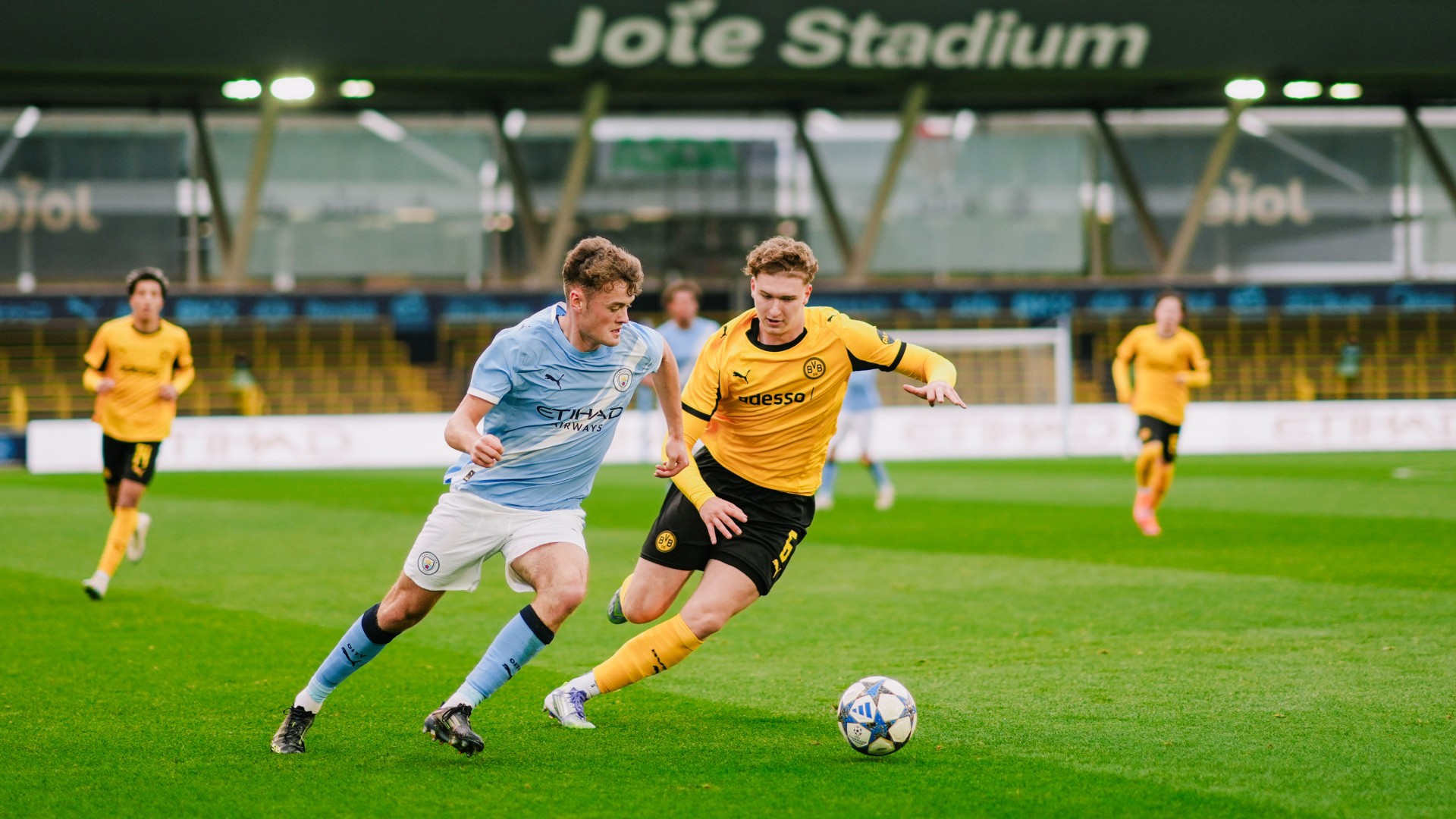 LEADING THE LINE : Matty Warhurst puts Dortmund's backline under pressure.