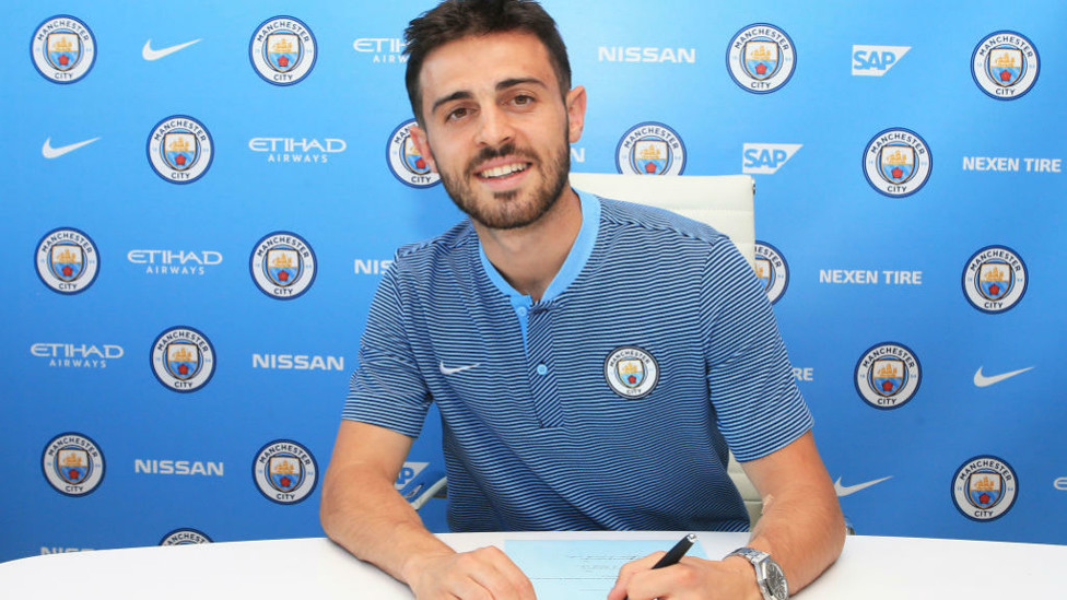 TRUE BLUE : Bernardo is all smiles after signing for City in the summer of 2017