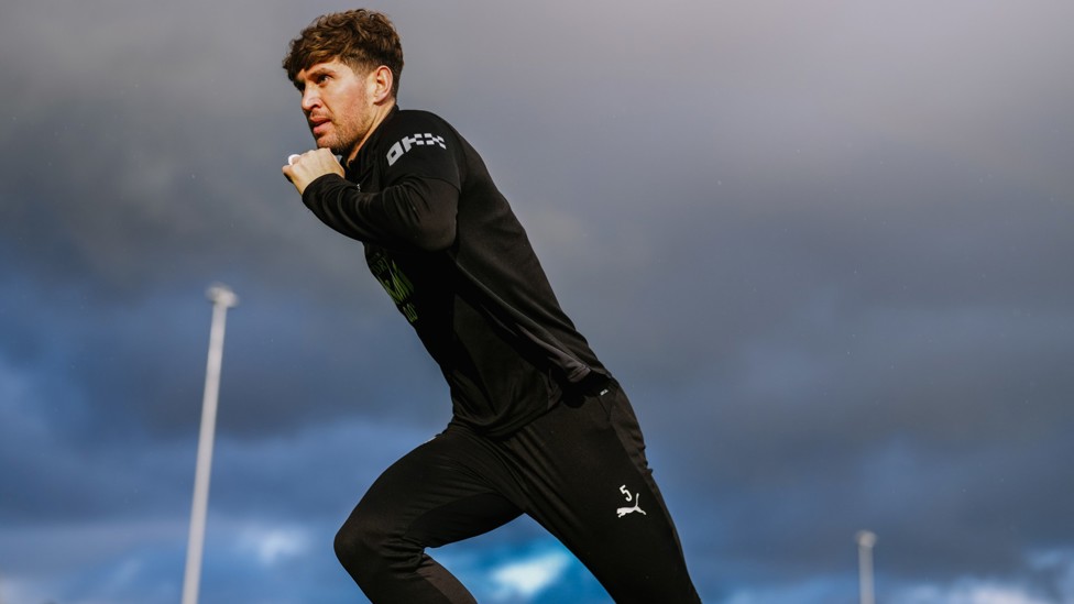 GREY STONES : John working under cloudy skies