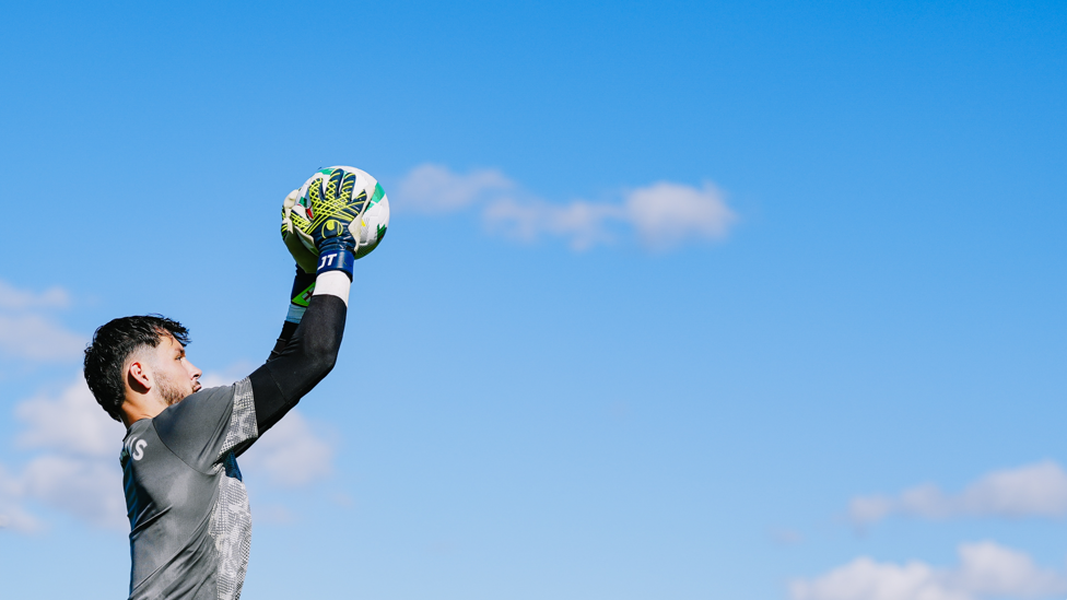 UP HIGH : James Trafford is tested with a high ball. 