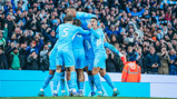 SHARING THE LOVE: The players celebrate with Mahrez.