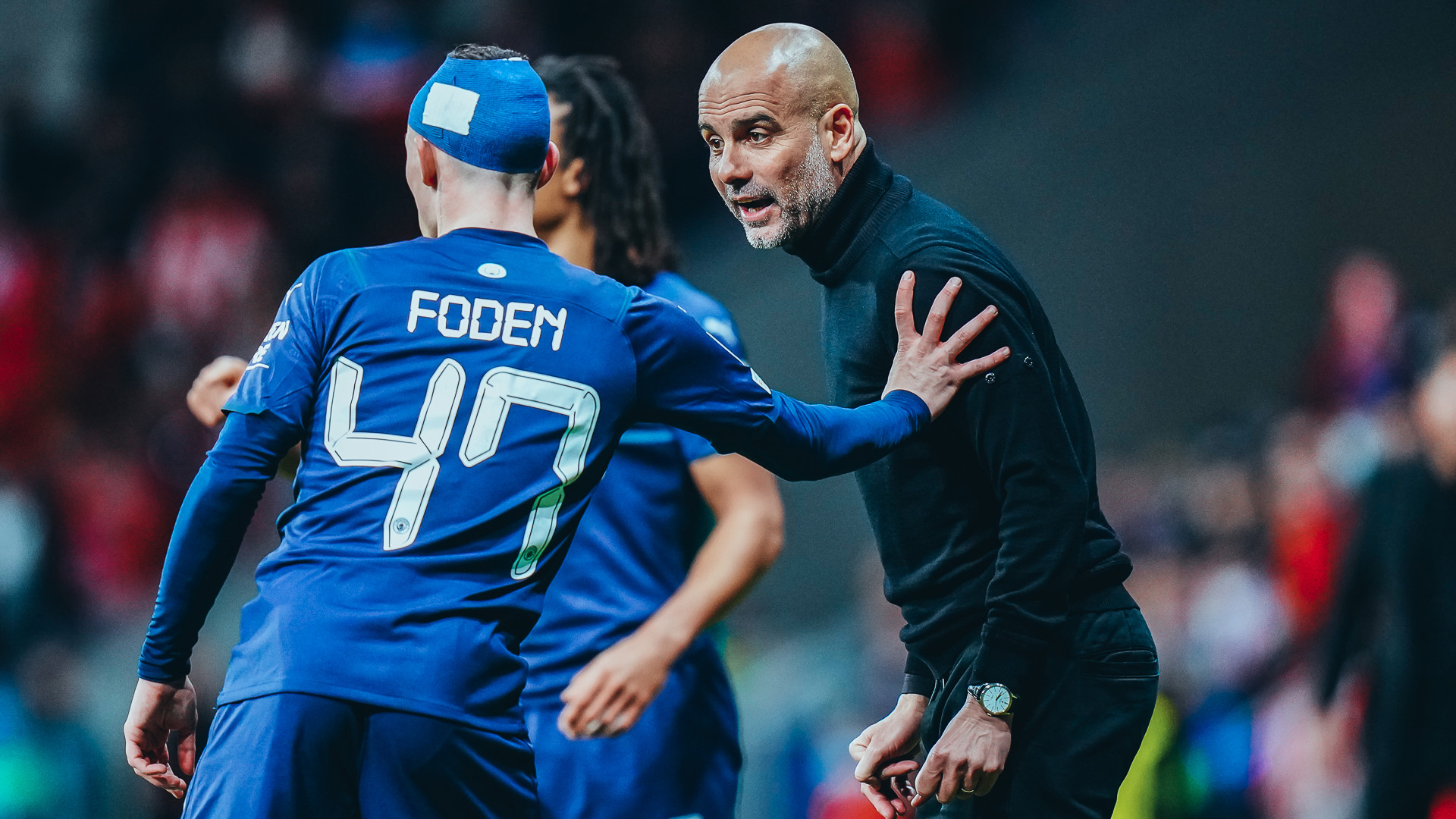 PEP TALK: The boss chats with Phil Foden