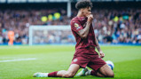 ONE OF OUR OWN: O'Reilly kisses the badge!