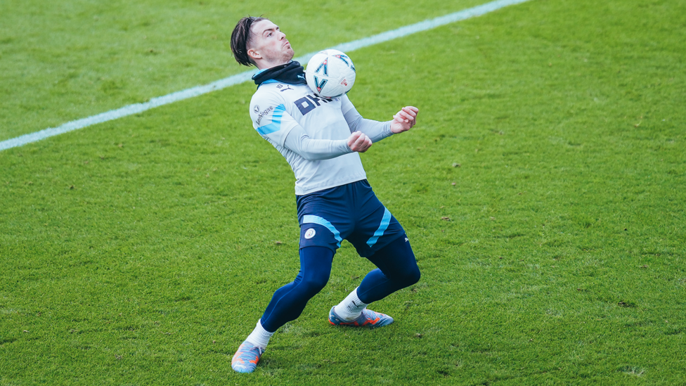 CHEST DAY : Jack Grealish takes the ball down