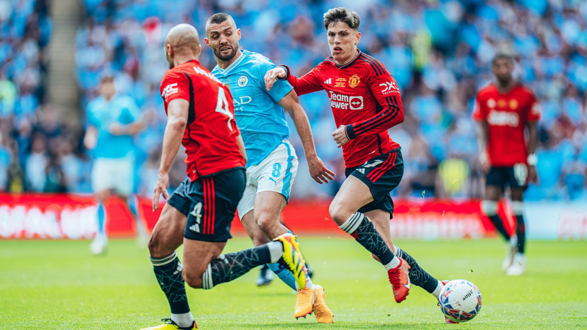 PRESS TO PLAY: Mateo Kovacic looks to fend off the United shackles.