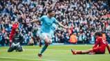 LEVELLER: Alvarez wheels away to celebrate the equaliser just before the half-hour mark.