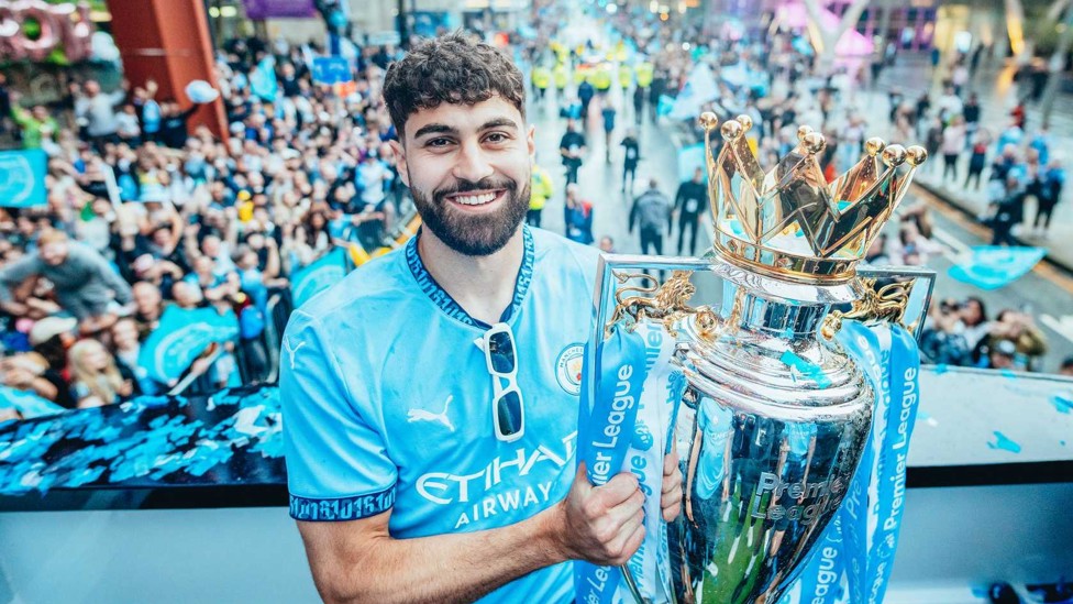 HAPPY DAYS : The defensive ace holds the Premier League trophy during our end-of-season Parade in Manchester city centre.