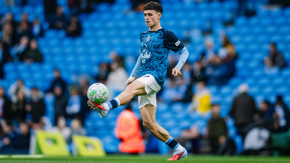 MIDFIELD MAESTRO : Foden gets in the mood during the warm up.