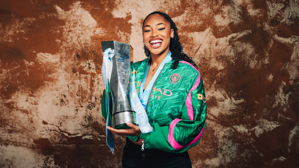 CHAMPION : She poses with the WSL title following our triumphant campaign.  