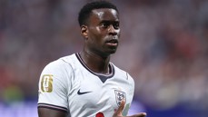 A football player wearing an England national team jersey with a FIFA World Cup 2026 patch on the sleeve.