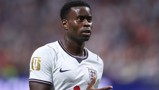 A football player wearing an England national team jersey with a FIFA World Cup 2026 patch on the sleeve.