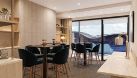 A modern lounge area featuring high tables with dark chairs, ambient lighting, and large windows offering a view of a stadium exterior. There are shelves with decor and a light wooden finish for a cozy atmosphere.