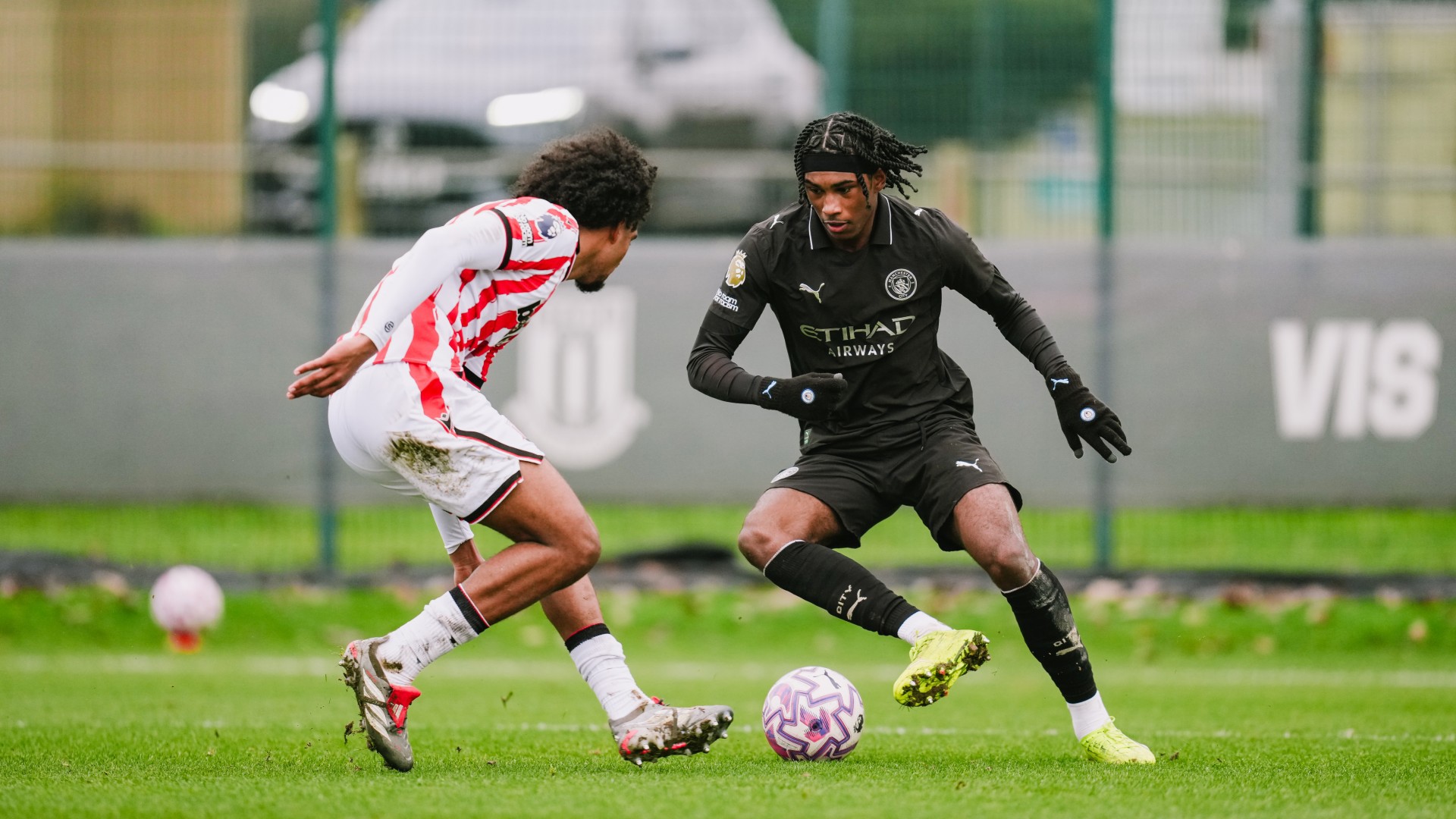 ONE-V-ONE : Reigan Heskey takes his man on.