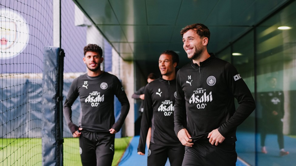SQUAD GOALS : Matheus Nunes, Nathan Ake and Nico make their way out for the session